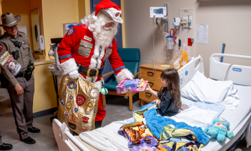 Trooper Santa visiting STHS Children's patients