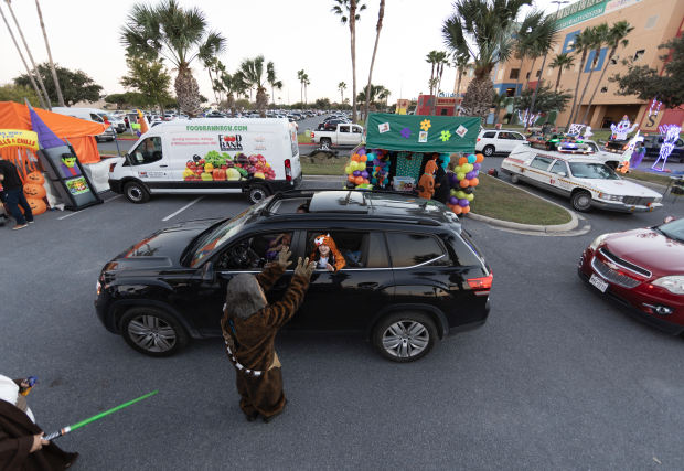 Chewbacca hands candy out for STHS Children's Trick-or-Treating event, Edinburg, Texas
