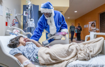 Michael Irvin giving a gift to a patient
