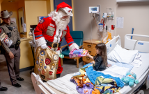 Trooper Santa visiting STHS Children's patients
